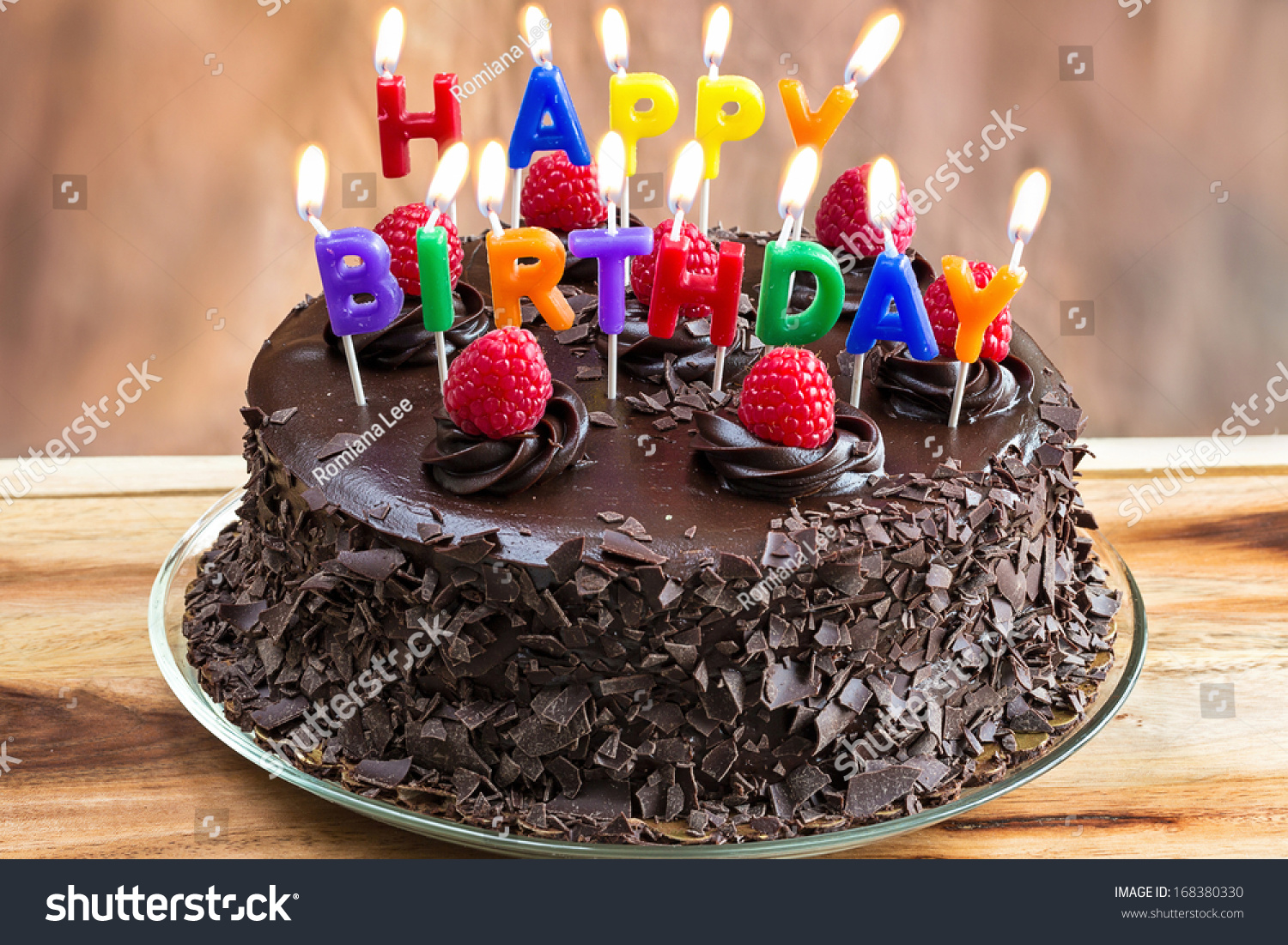 Happy Birthday Candles On Chocolate Cake Imagen de archivo ...