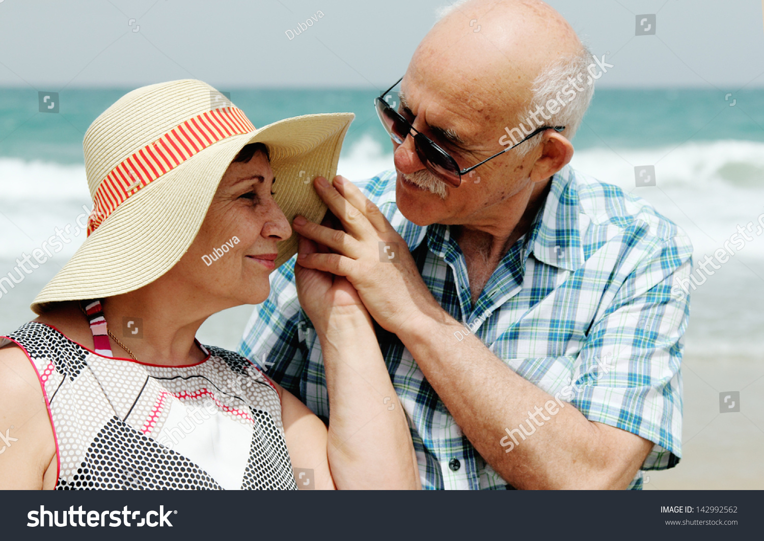 Happy elderly couple enjoying their vacation near the sea