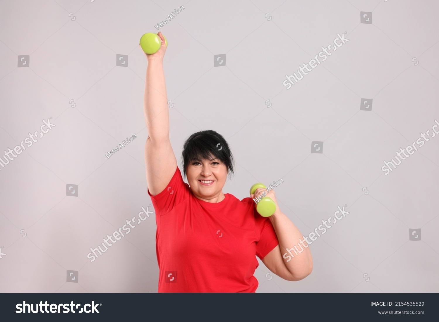 Happy Overweight Mature Woman Doing Exercise Stock Photo 2154535529