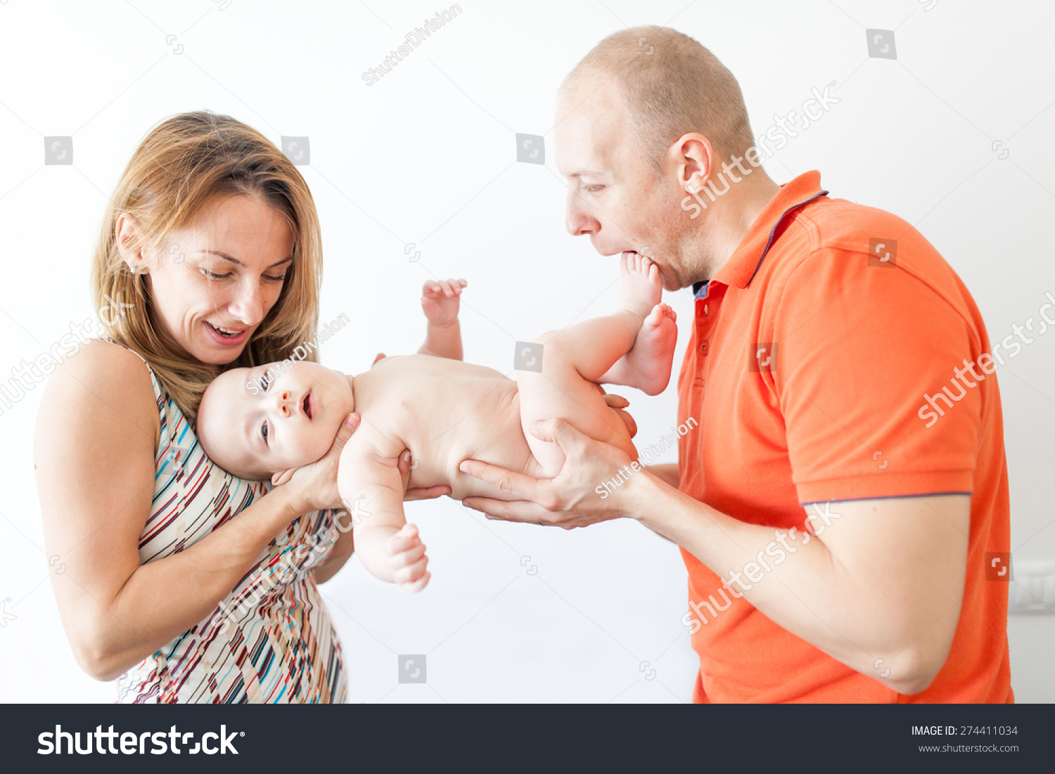 Happy Parents Holding Naked Baby Boy Stock Photo Edit Now