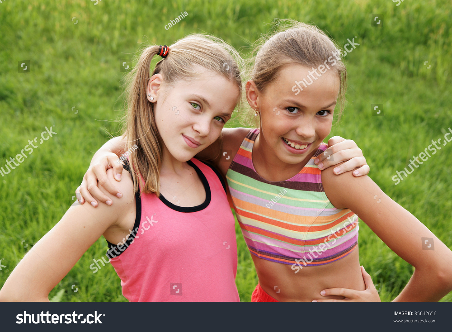 Happy Preteen Girls Friendly Hugging On Green Grass 5202 The Best