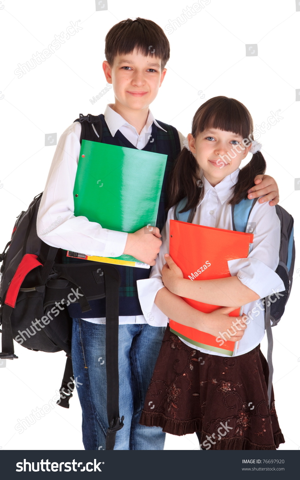 Happy Young Brother And Sister With School Books And Bags, Isolated On 