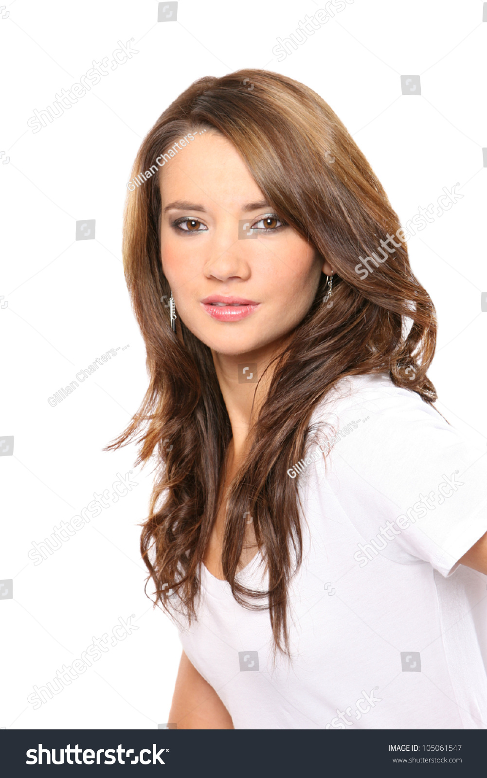 Head And Shoulders Portrait Of A Beautiful Young Woman With Long Dark