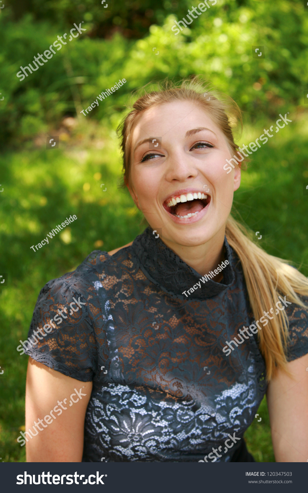 Headshot Of Beautiful Blonde Girl Laughing Outsi