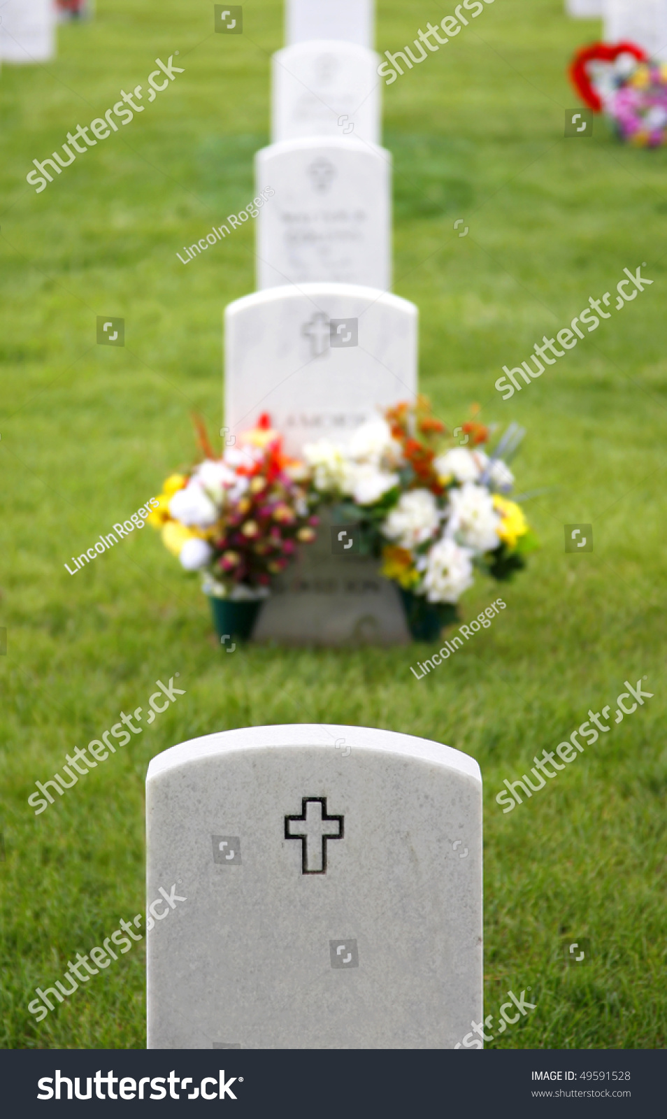 Headstones And Flowers Mark The Graves Of Fallen Soldiers At Fort Logan ...