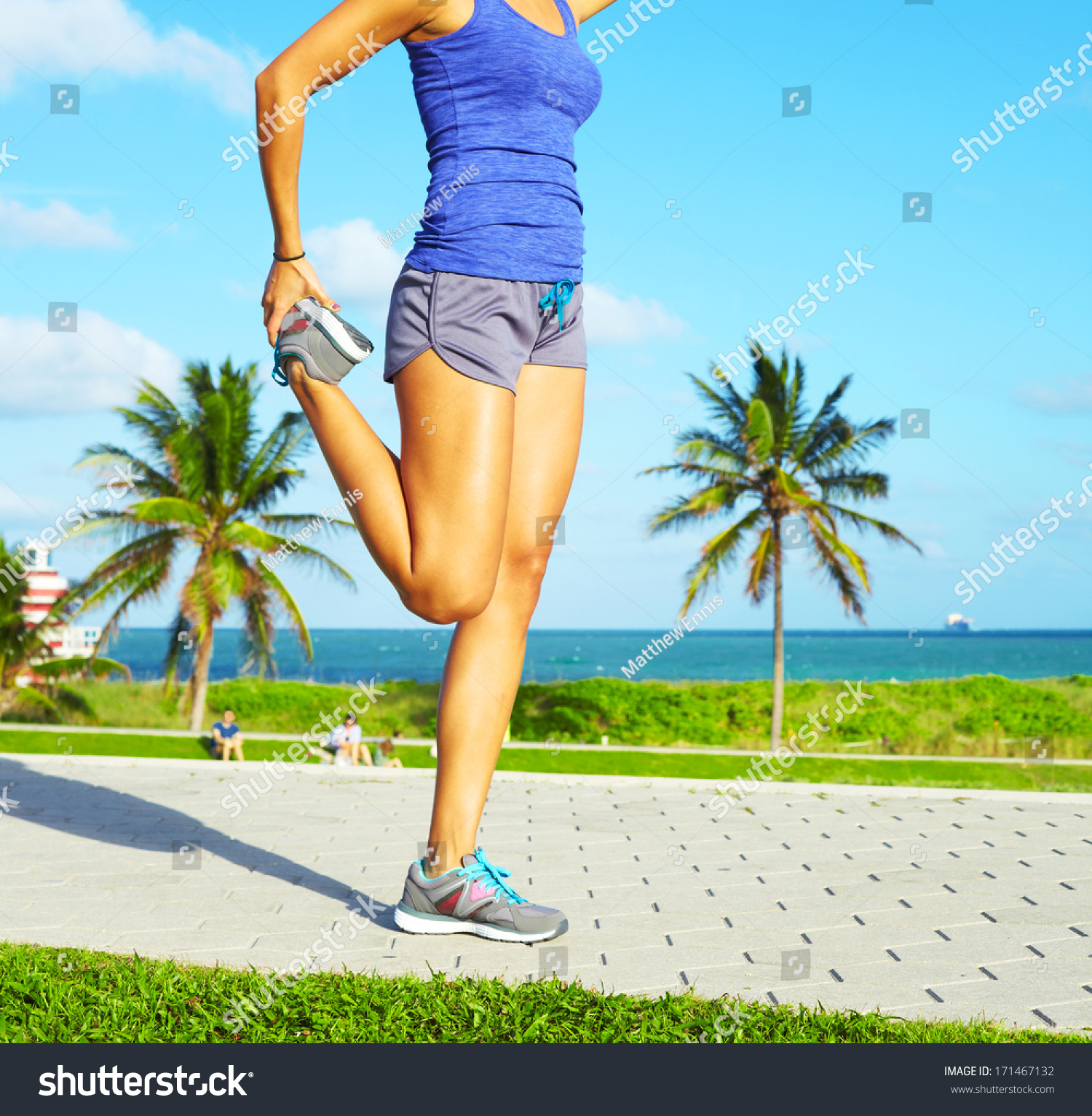 Healthy Young Pretty Mixed Race Woman Stretching Her Leg During Exercise On Running Trail Near