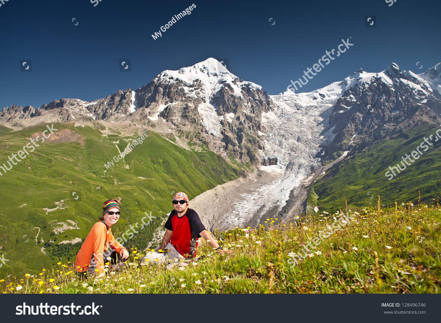 Hiker Takes A Rest Observing A Mountain Panorama Stock Hiker Takes A Rest Observing A Mountain Panorama Stock