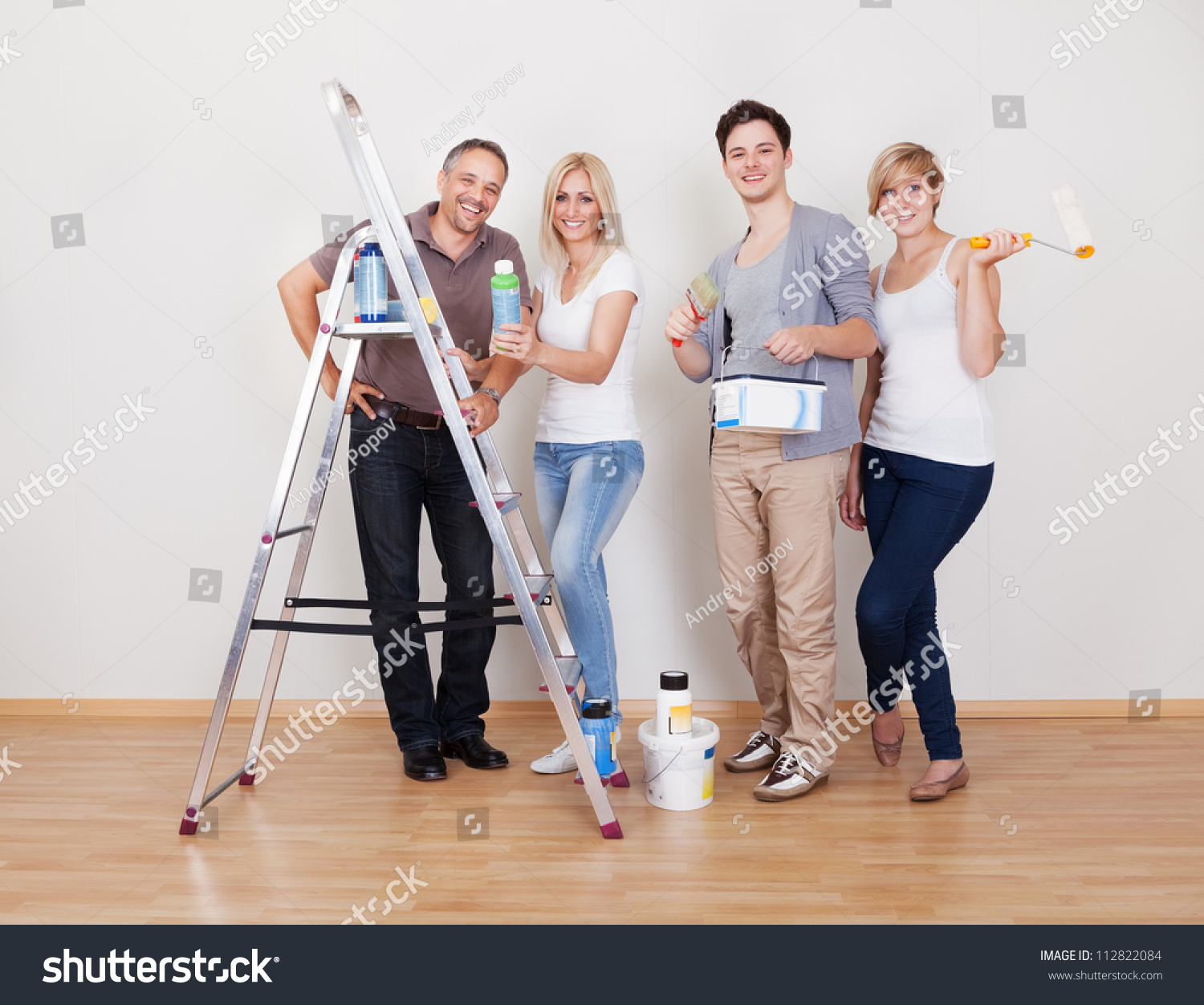 Home Maintenance Repair Team With All Four Members Of The Family Lined 