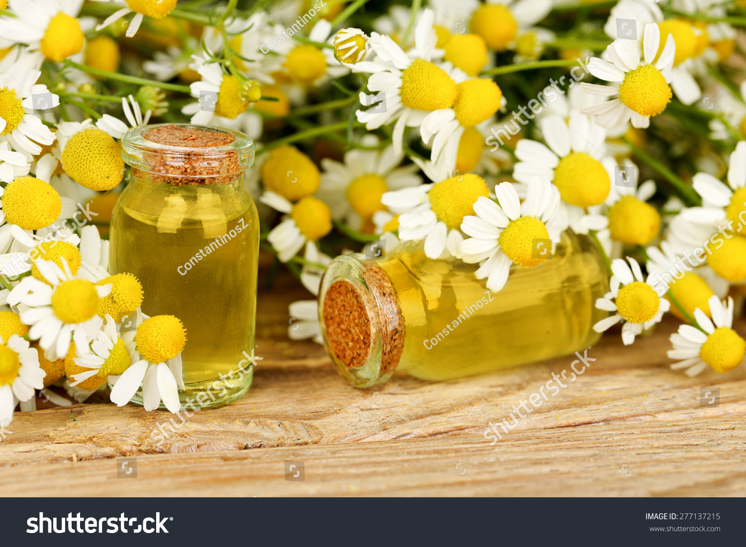 Homeopathy Concept With Bottles And Chamomile Flowers On Wood Stock ...