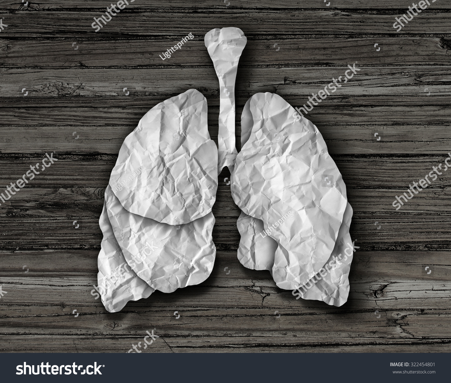 Human lung concept or healthy lungs organ made of cut crumpled white paper on an old wood background representing the medical anatomy of the respiratory system to provide oxygen to the body Human lung concept or healthy lungs organ made of cut crumpled white paper on an old wood background representing the medical anatomy of the respiratory system to provide oxygen to the body