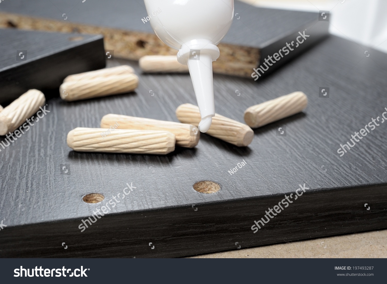 Inserting Glue To The Hole On Black Particleboard Stock Photo 197493287