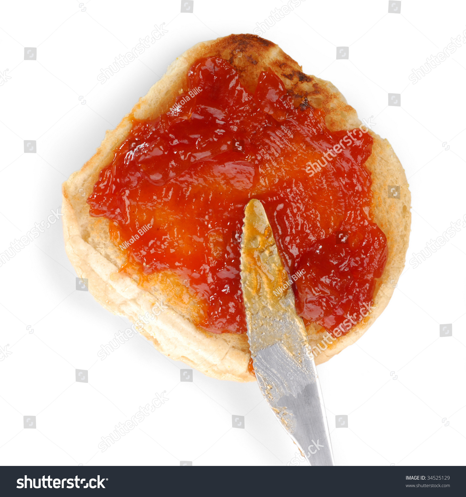 Jam Spread Being Spread Onto A Piece Of Bread Stock Photo 34525129