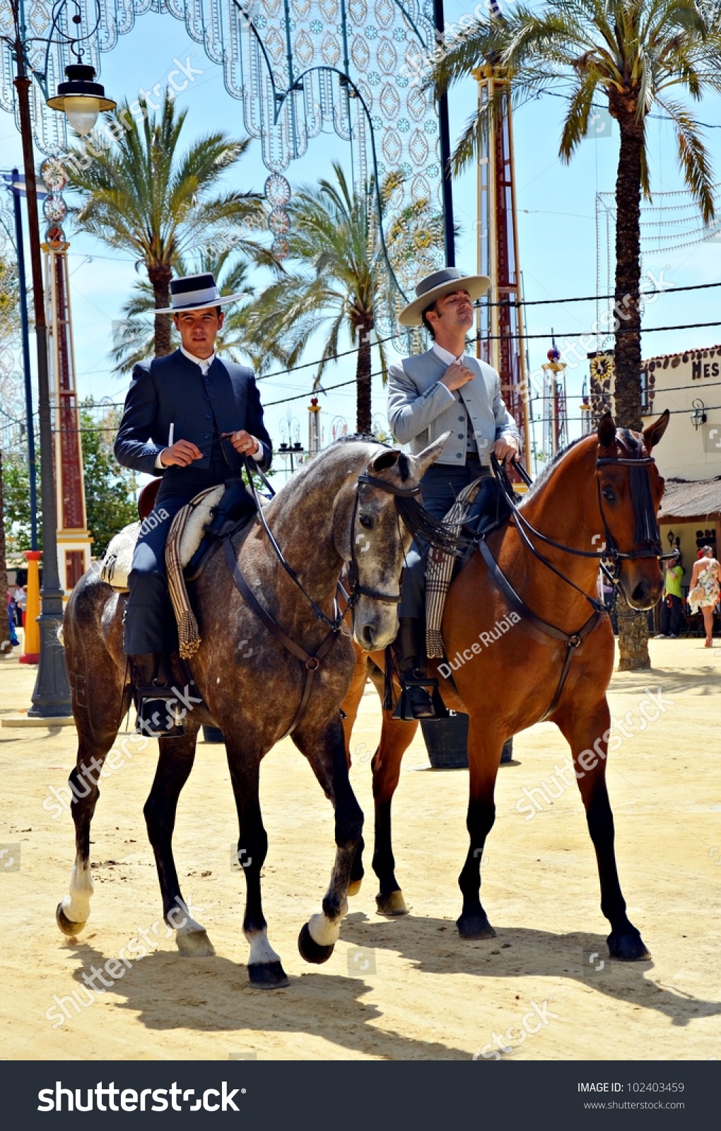 Jerez De La Frontera, SpainMay 12Riders On Horseback Walking Through