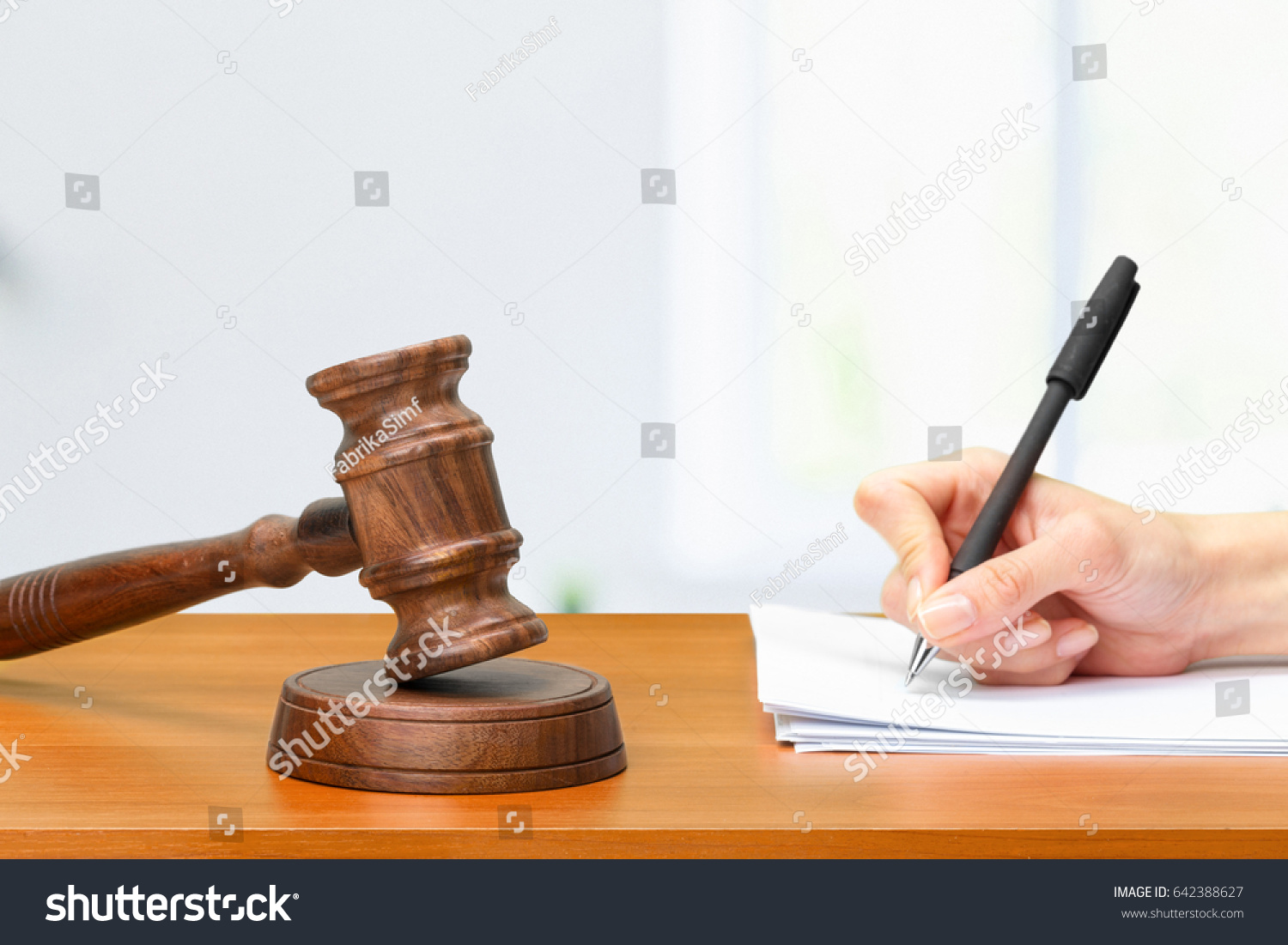 Judge Writing On Paper Courtroom Stock Photo Edit Now