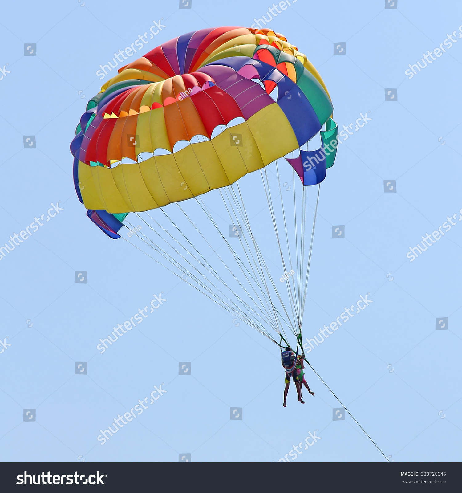 KEMER TURKEY AUGUST 18 2015 Parasailing in a blue sky near sea beach Parasailing is a popular recreational activity among tourists in Turkey KEMER TURKEY AUGUST 18 2015 Parasailing in a blue sky near sea beach Parasailing is a popular recreational activity among tourists in Turkey