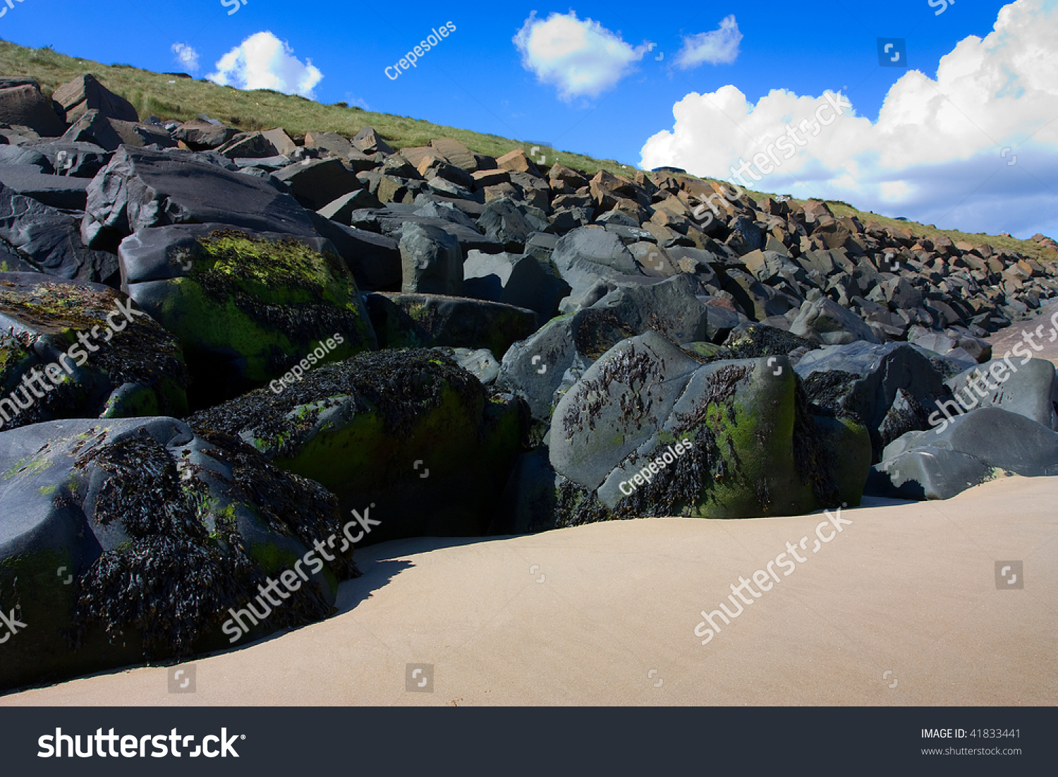 Large Black Boulders At Cambois Beach Northumberland Stock Photo