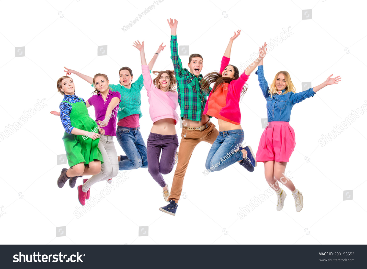 Large Group Of Cheerful Young People Jumping For Joy Isolated Over