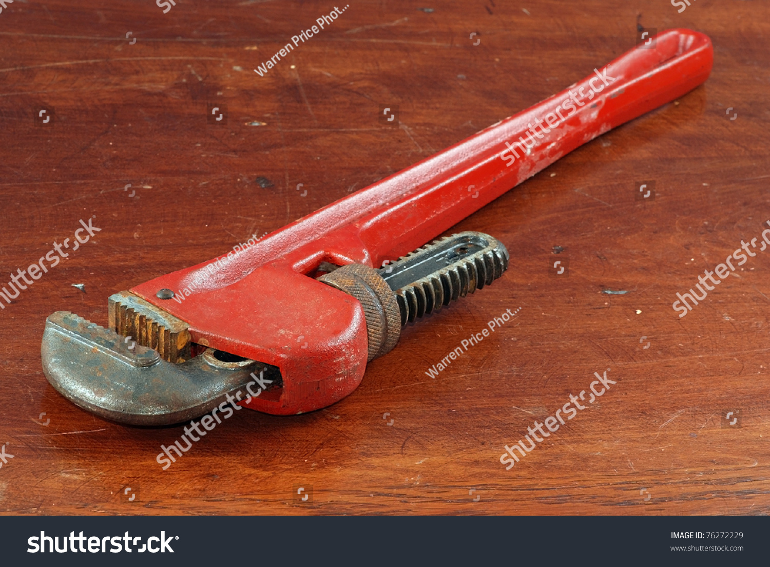 large-16-inch-pipe-wrench-laying-on-wooden-workbench-sometimes-called