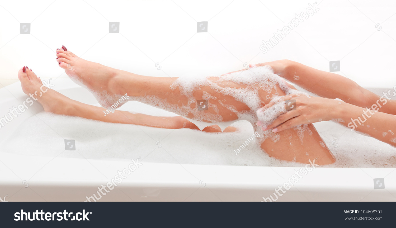 Legs Of Beautiful Young Asian Female In Bath Tub