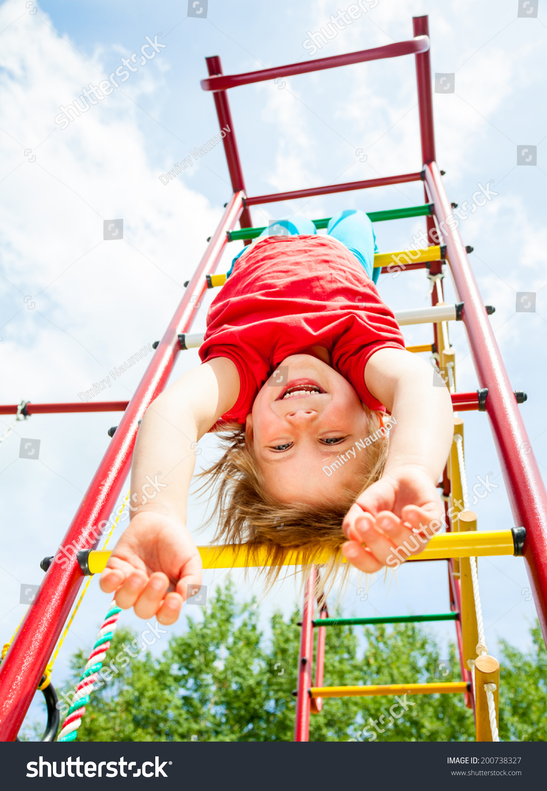 Young Girl Playing On Monkey Bars At The Park Stock Photo 