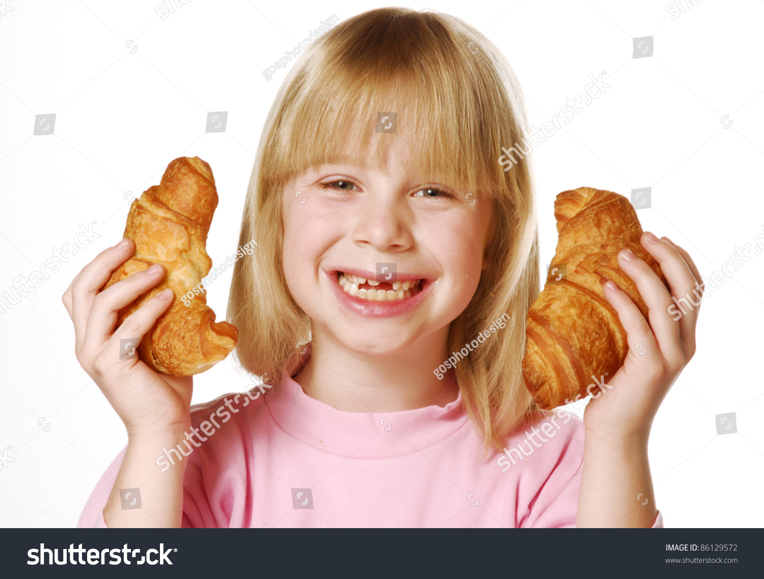 stock-photo-little-girl-holding-and-eati
