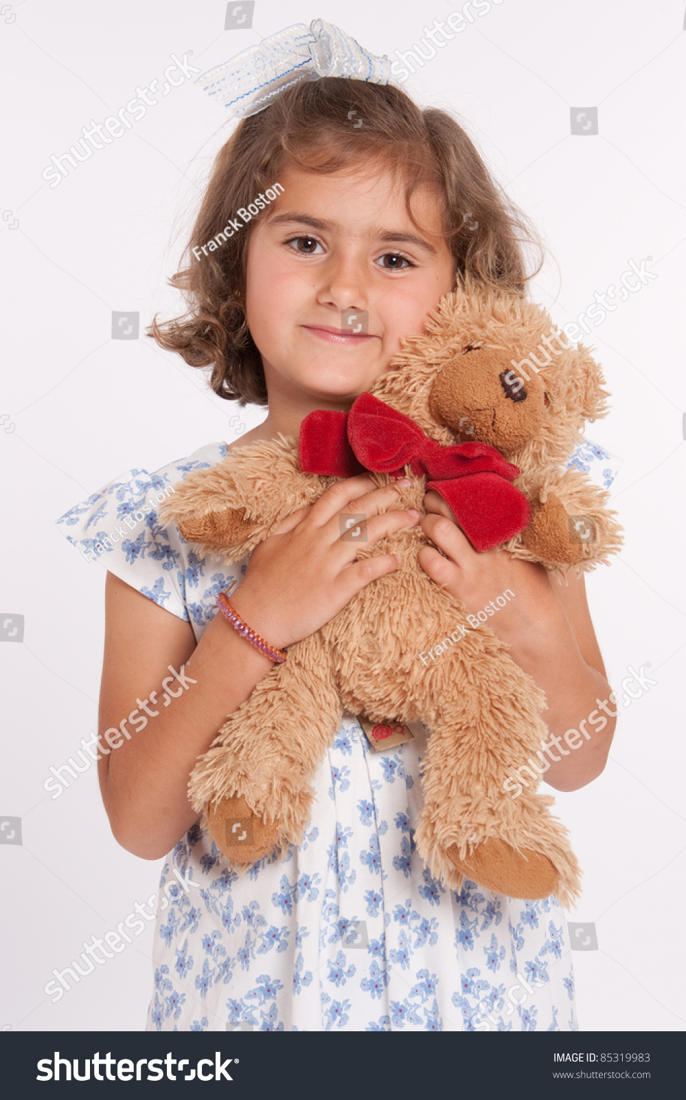 little girl with a teddy bear