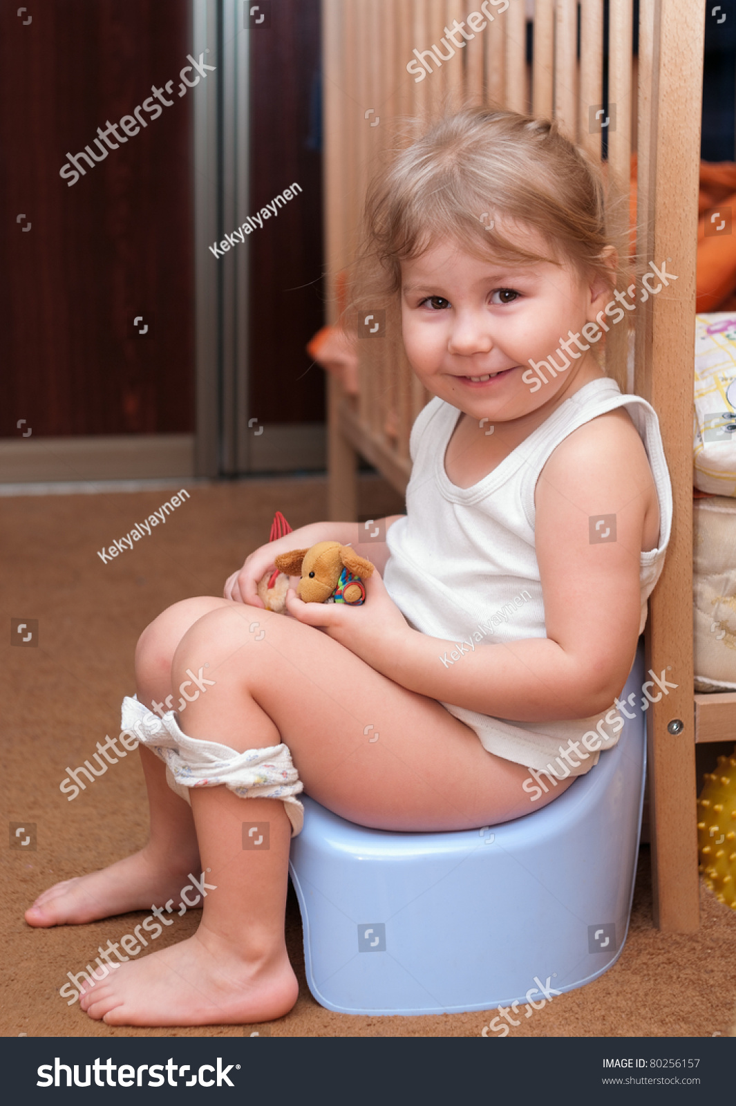 http://image.shutterstock.com/z/stock-photo-little-girl-sitting-on-a-chamber-pot-in-the-room-80256157.jpg