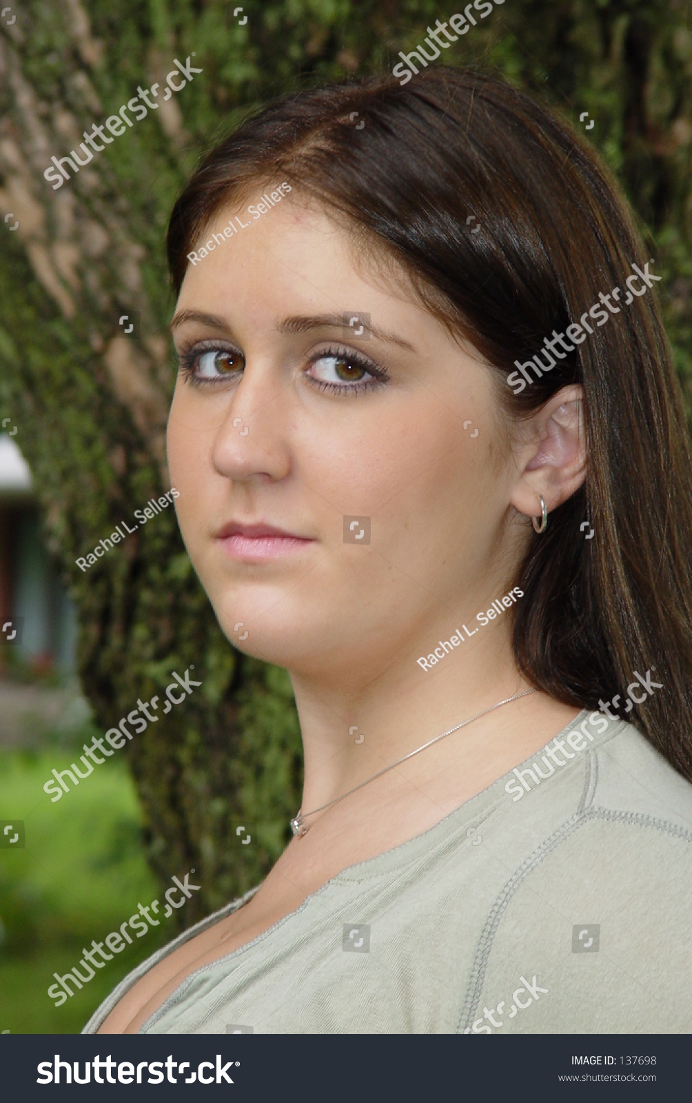 Long Dark Haired Brown Eyed Teenage Stock Photo