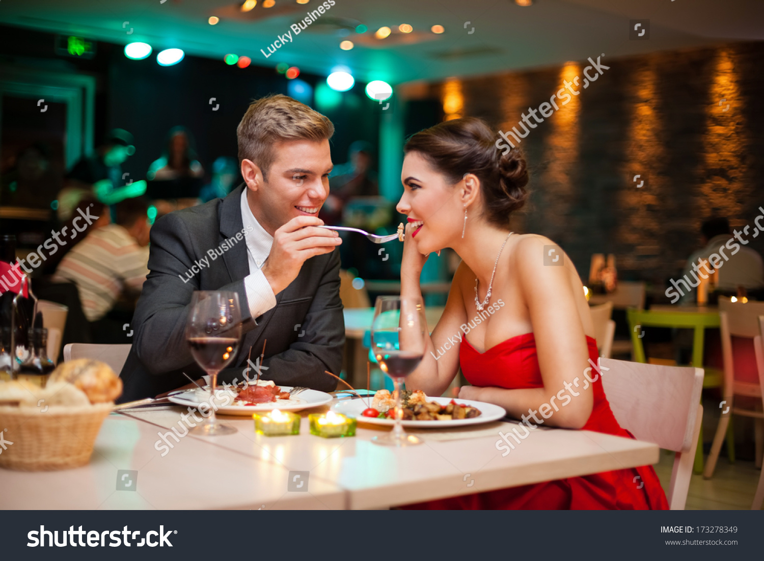 Lovely Young Couple Eating On Romantic Dinner Stock Photo 173278349