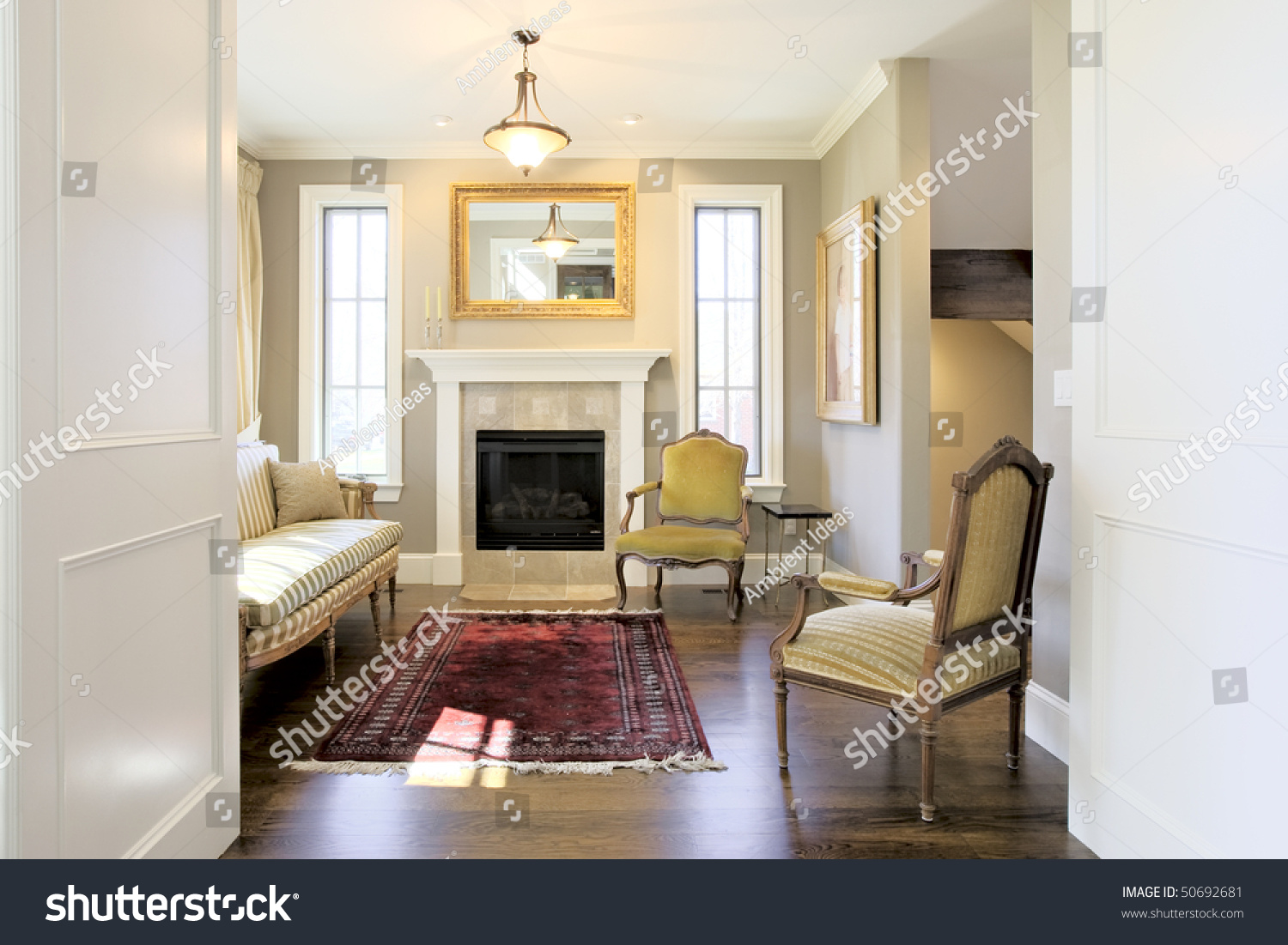 Luxury home foyer entry with elegant, classic furniture staging ...