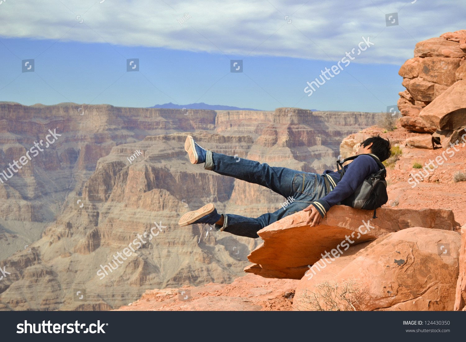 stock-photo-man-falling-from-the-rock-in-grand-canyon-arizona-usa-124430350.jpg