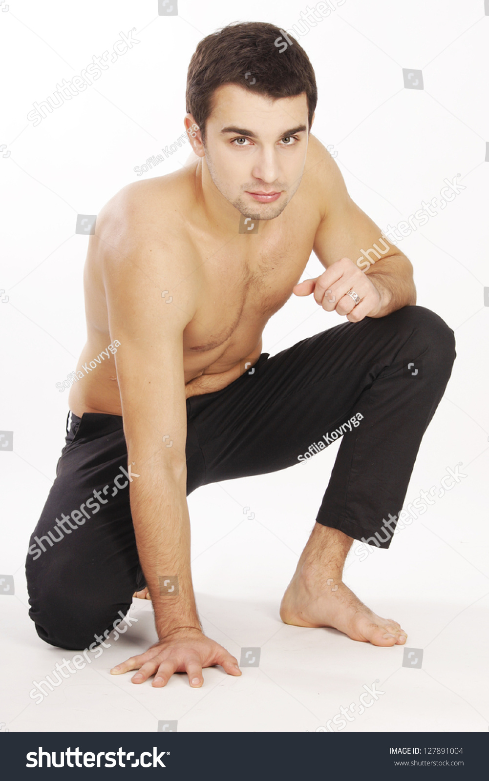 Man Poses On One Knee In Studio Stock Photo 127891004 Shutterstock