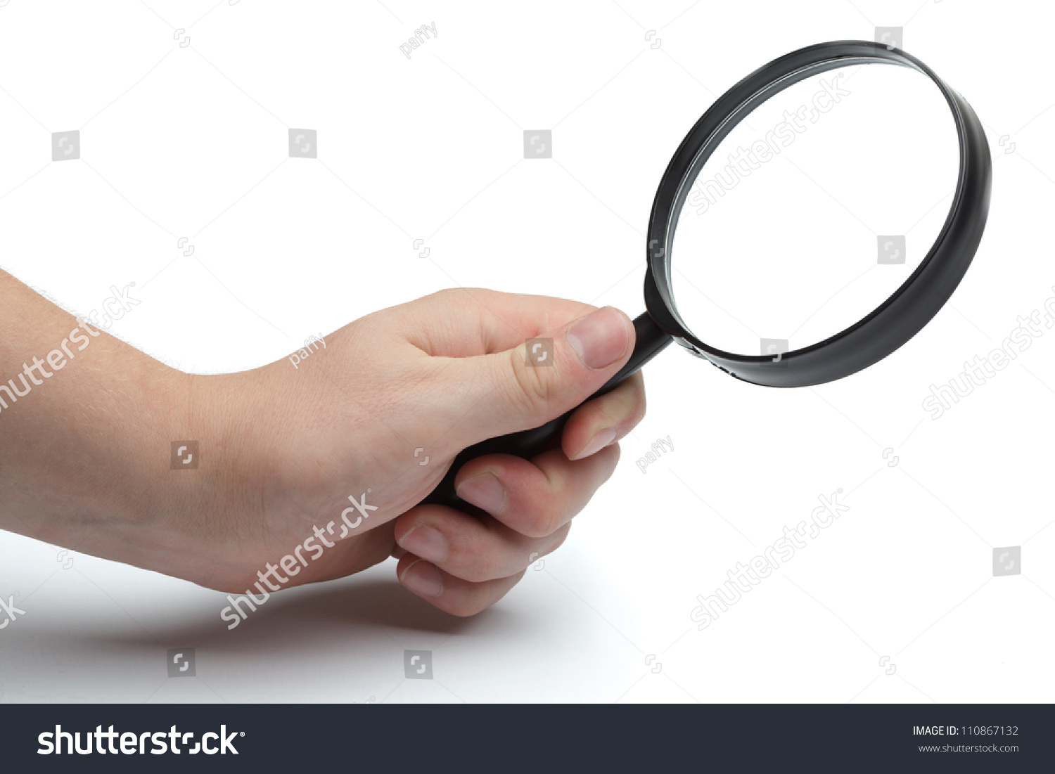 Mans Hand Holding Magnifying Glass Closeup Isolated On White