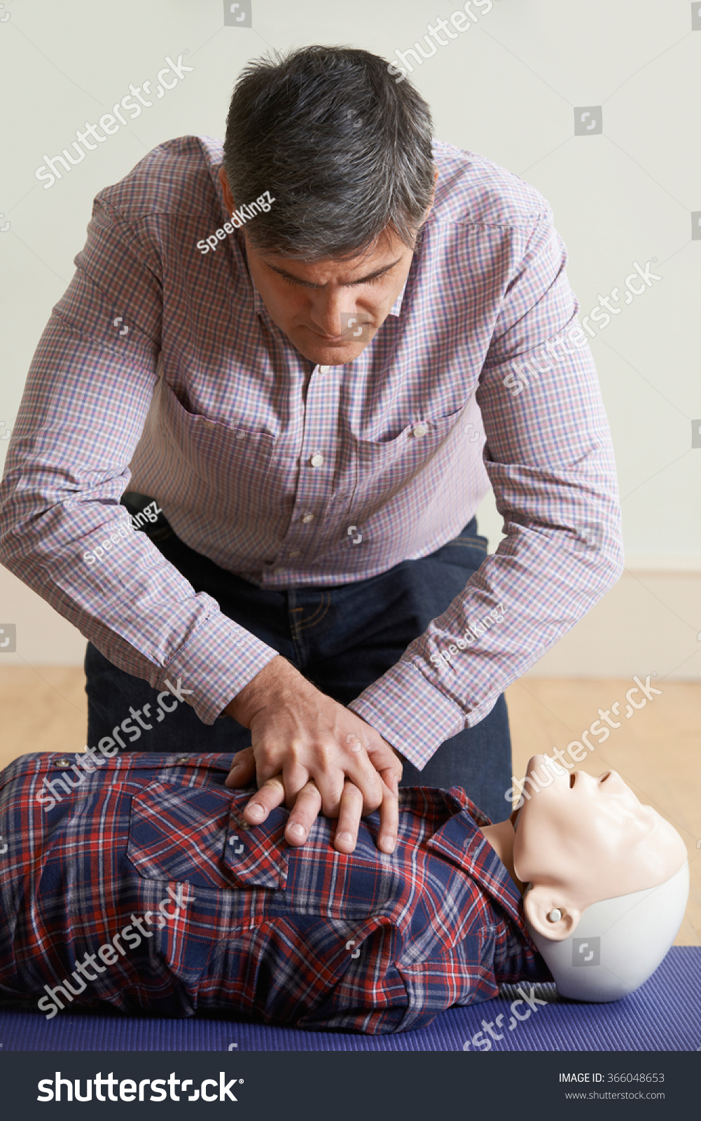 Man Using Cpr Technique On Dummy In First Aid Class Stock Photo 366048653 Shutterstock