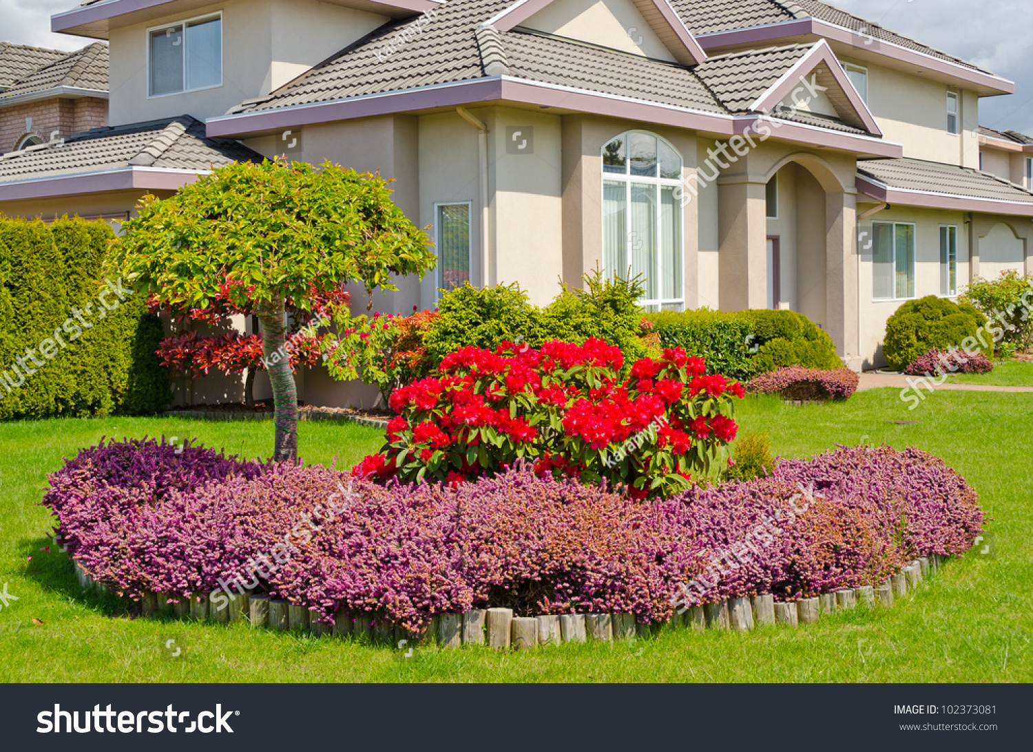 Manicured House And Garden Displaying Annual And Perennial Gardens In ...