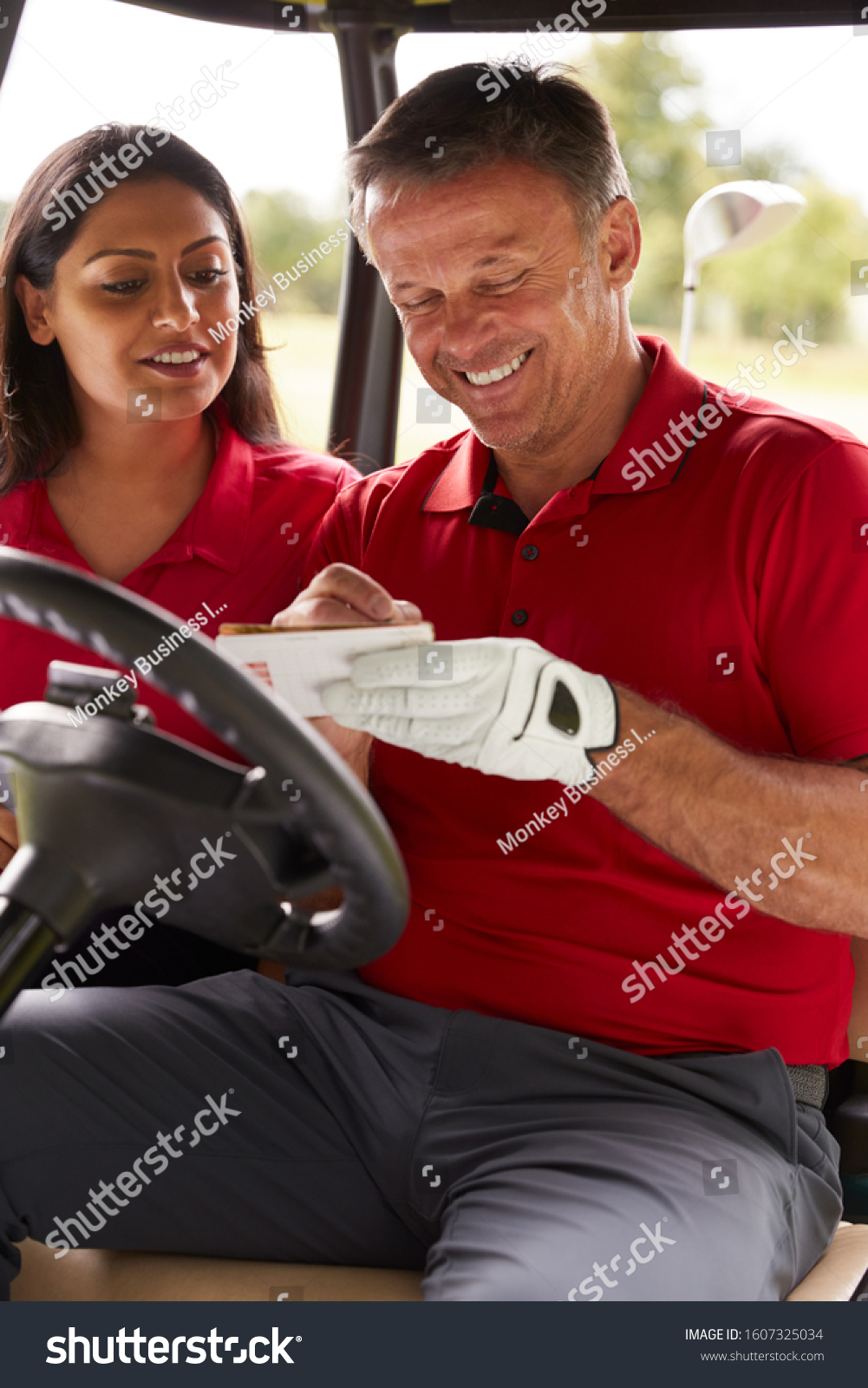 Mature Couple Playing Golf Marking Scorecard Stock Photo Edit Now