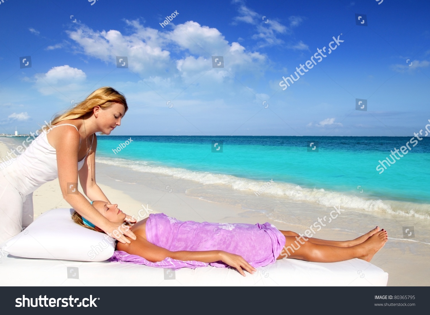 Mayan Reiki Therapy Massage In Caribbean Beach With Two Women Stock