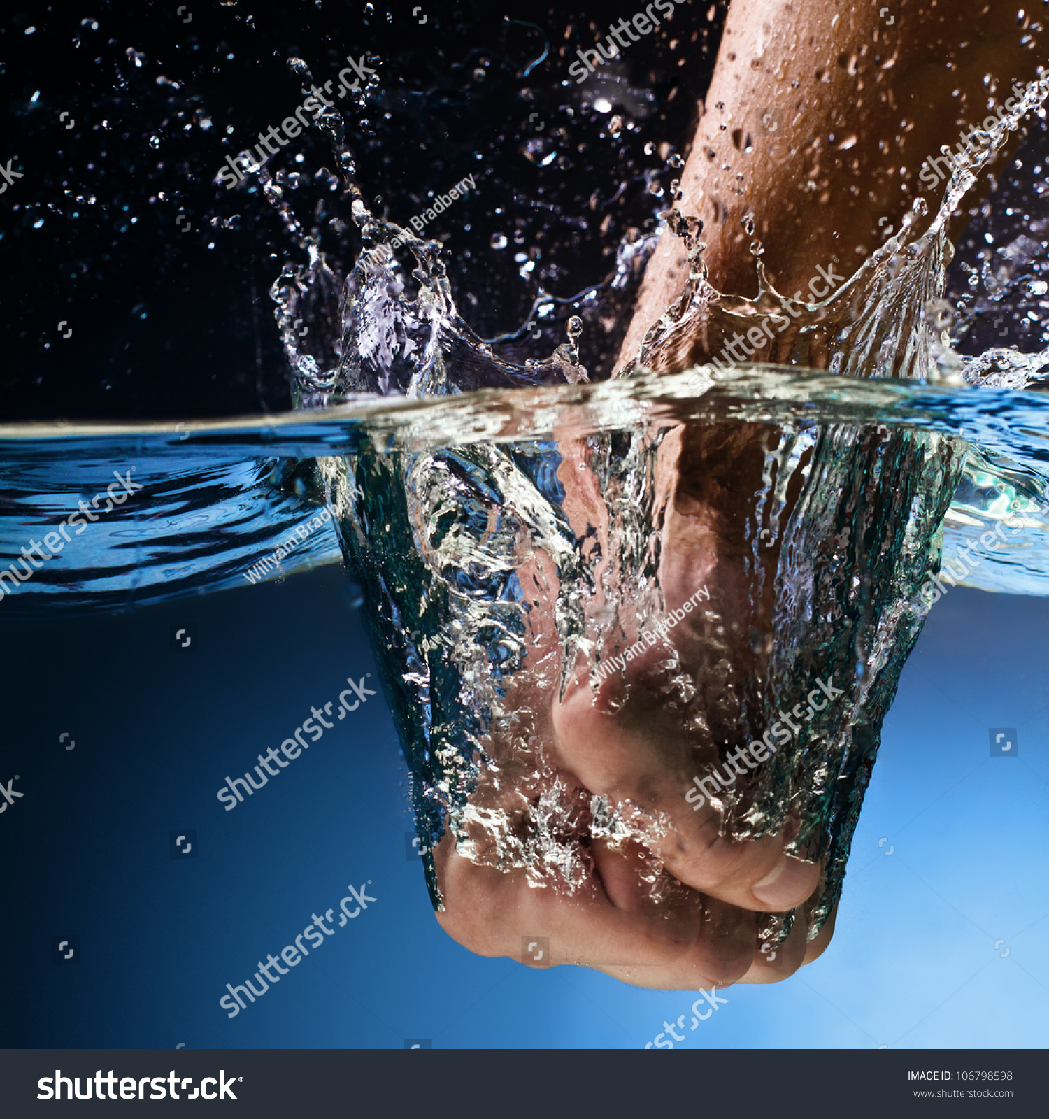 Men'S Fist Punching Water Splash Stock Photo 106798598 Shutterstock