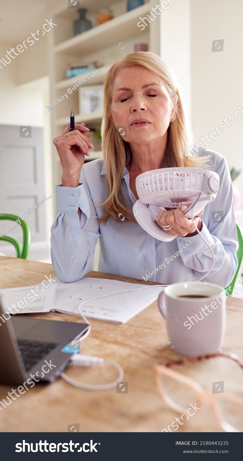 Menopausal Mature Woman Having Hot Flush Stock Photo 2180443235