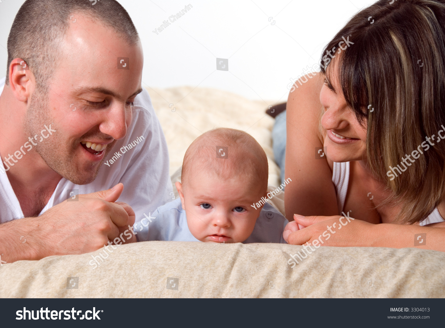 Mom Dad And The New Born Baby Lying On The Bed Stock Photo 3304013 ...