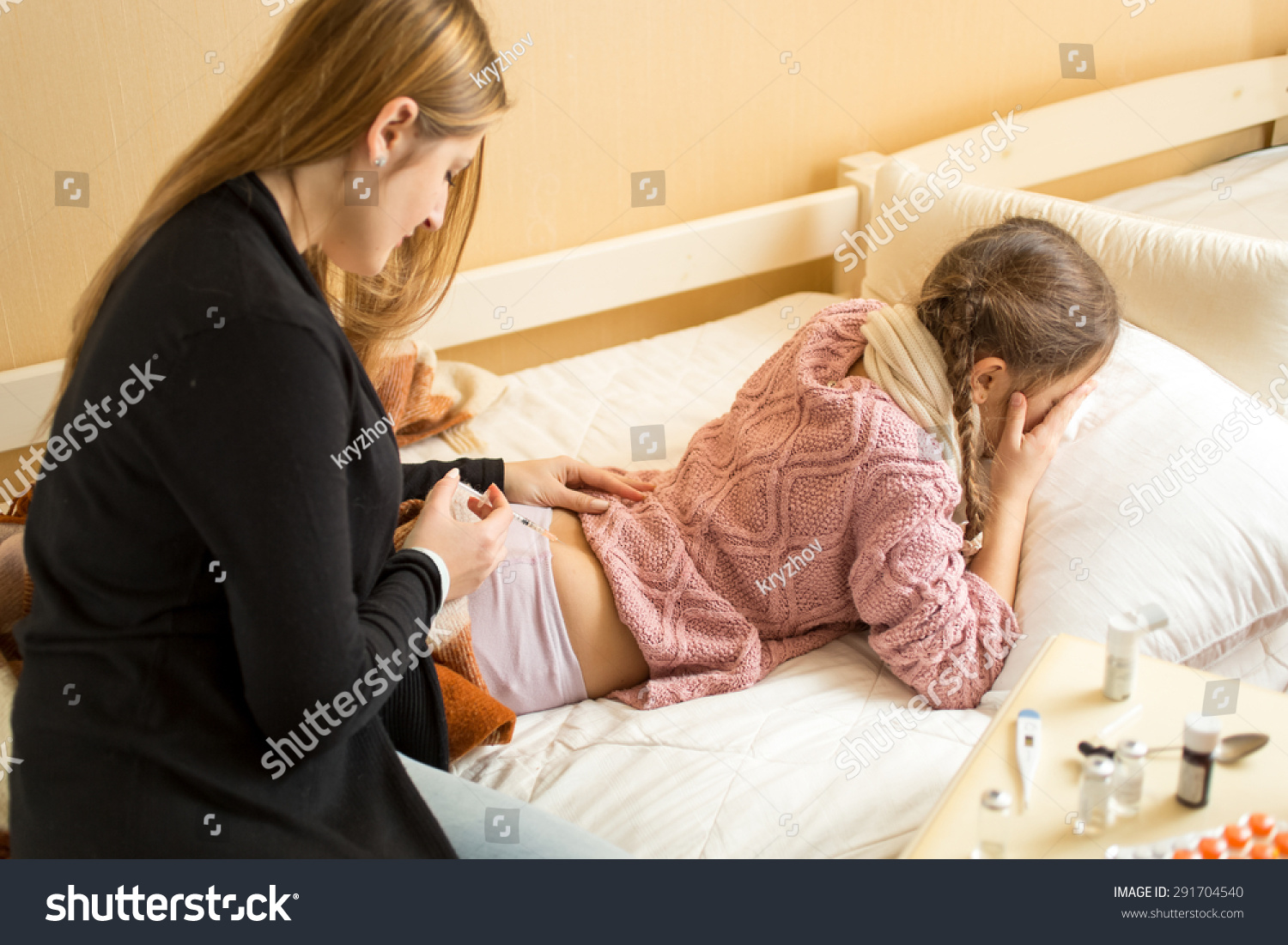 Mother Making Injection In Sick GirlS Bottom Lying On Bed St