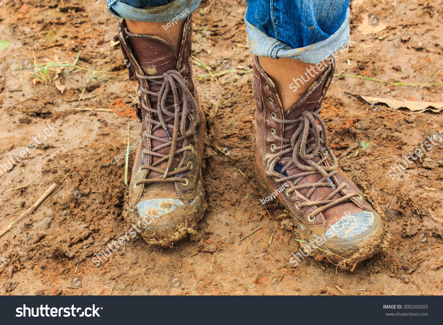 Muddy Feet Shoes Walking Through The Mud Stock Photo 300245003