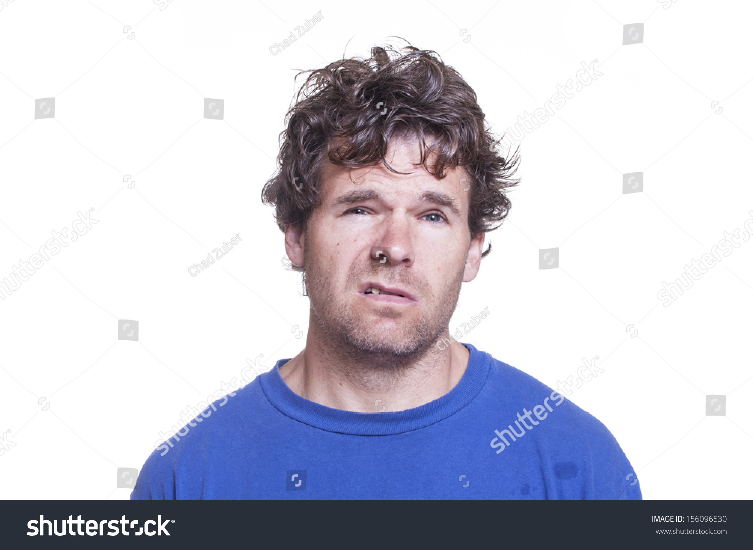 Mug Shot Of Messy Scruffy Drunk Caucasian Man On White Background Stock