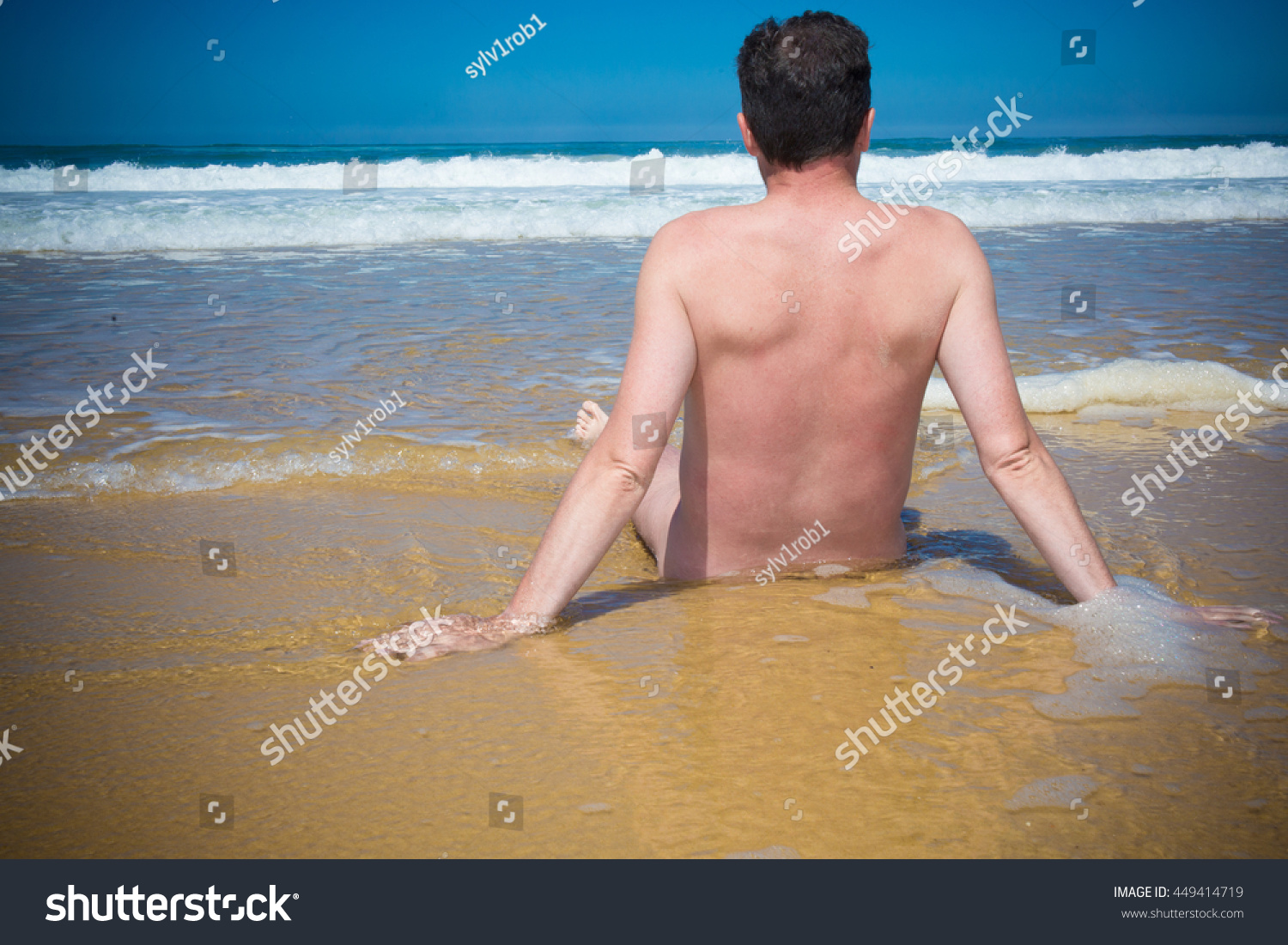 Стоковая фотография 449414719 Naked Man Sitting Cross Legged On