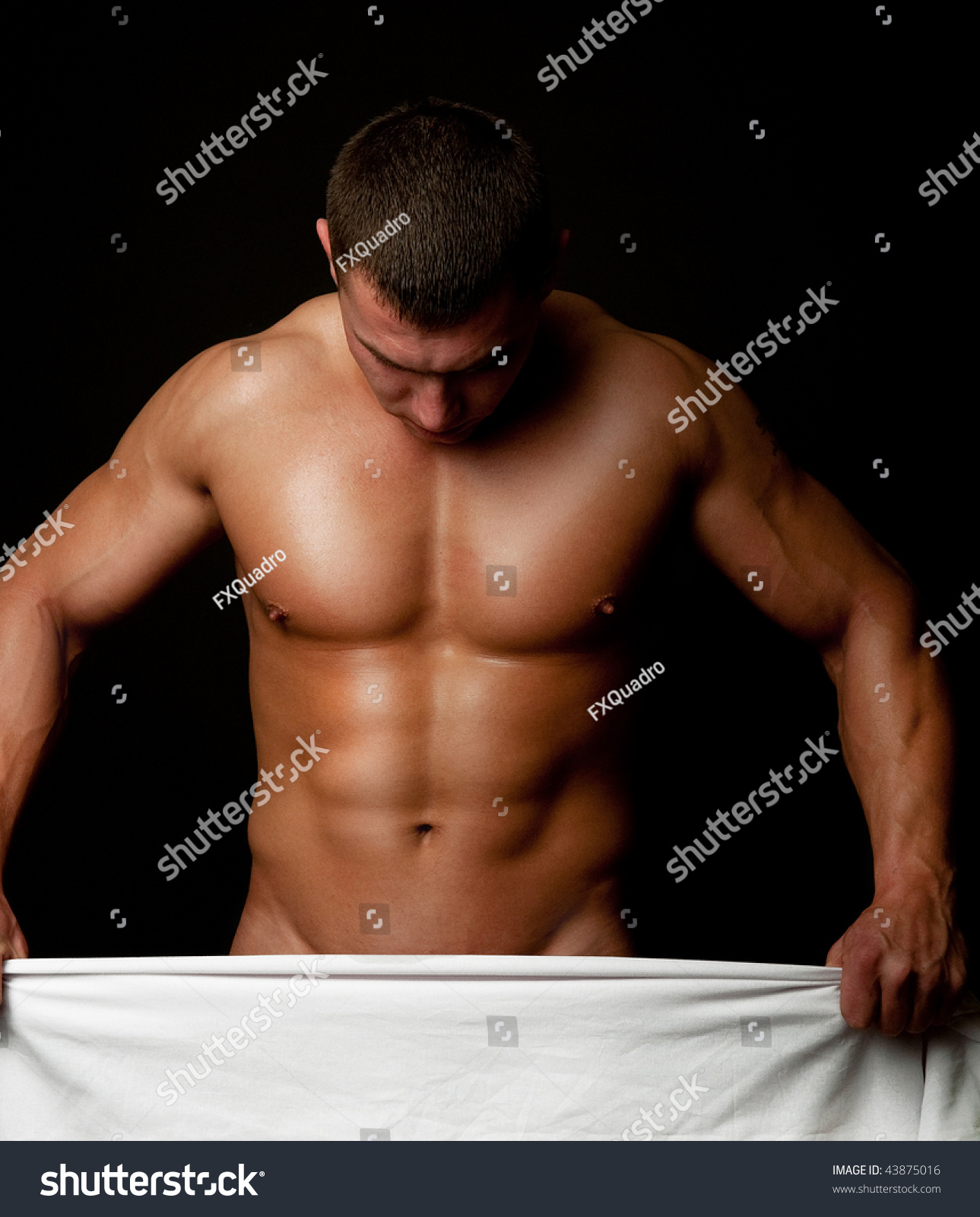 Naked Muscular Male Holding A White Towel As Cover Stock 