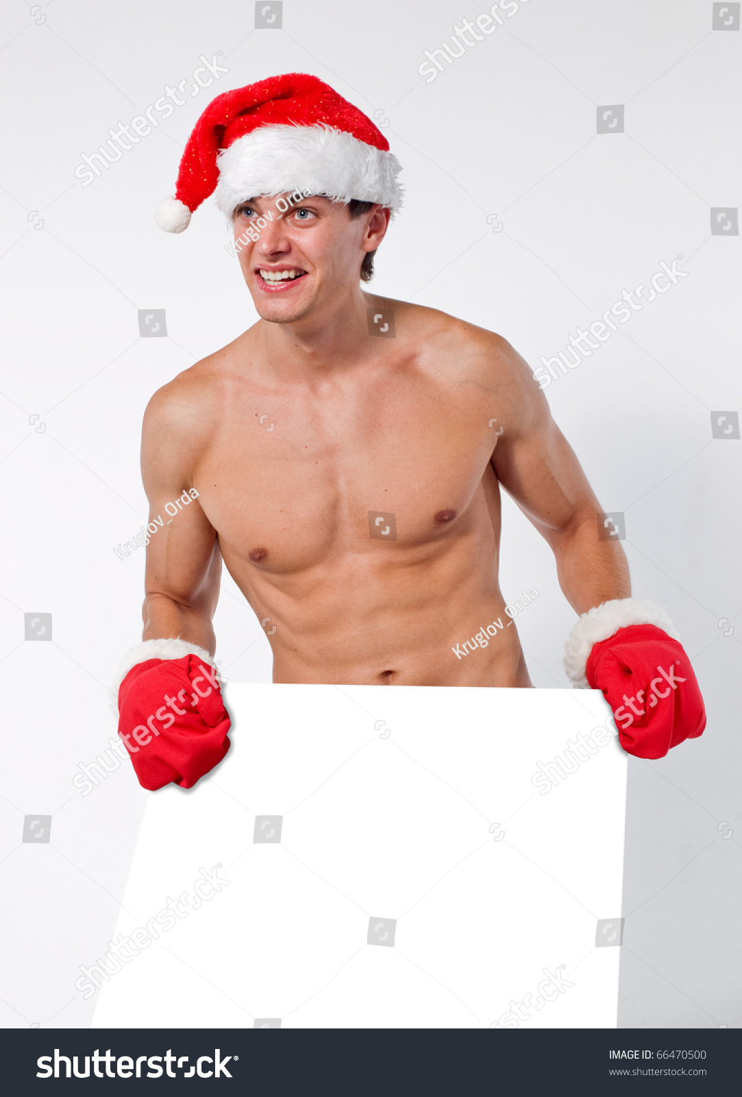 Naked Santa Claus On A Light Background New Year Man Is In A Red Cap And Mittens Stock Photo