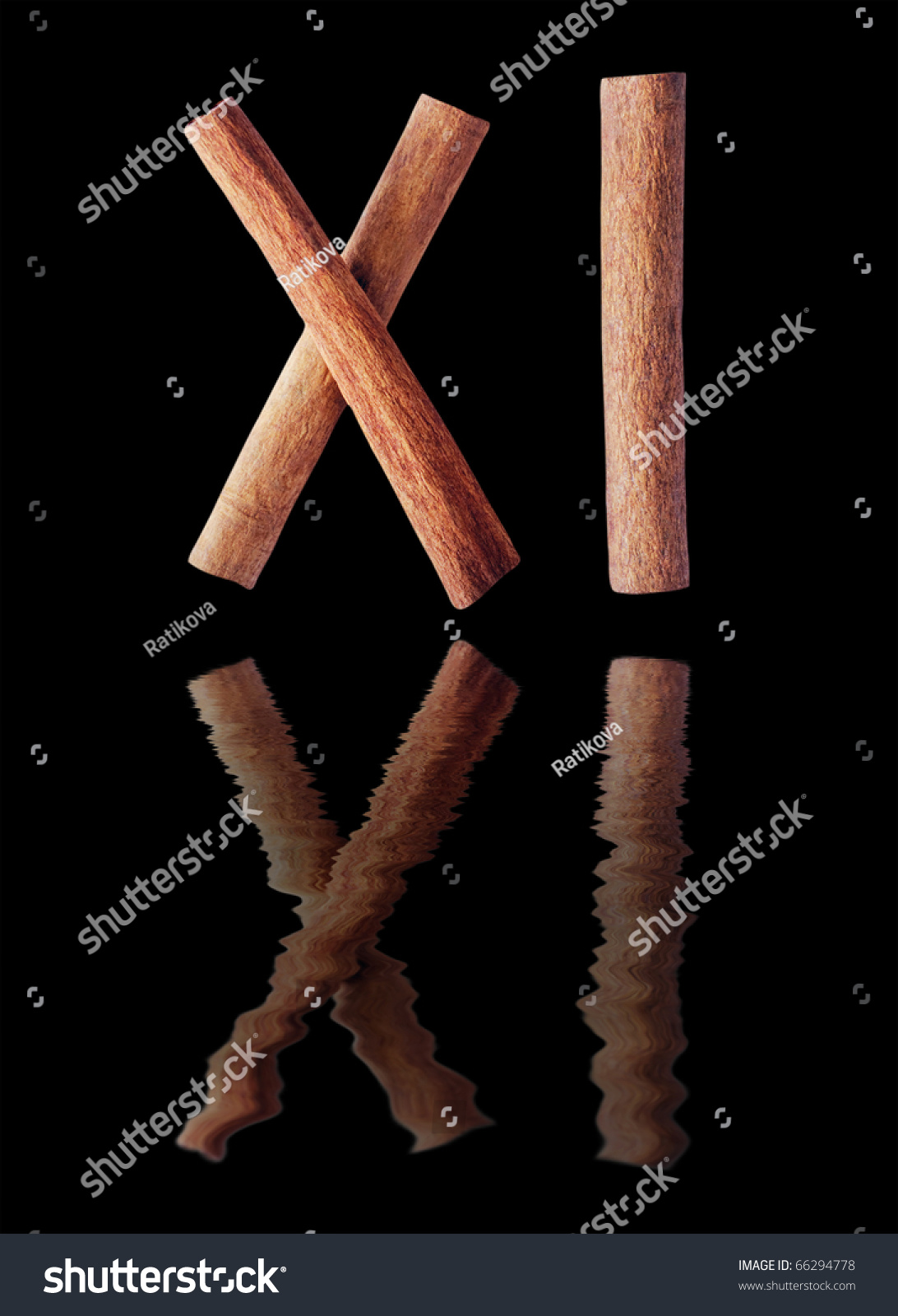 number-eleven-roman-numerals-from-cinnamon-sticks-isolated-on-the-black-with-reflation-stock