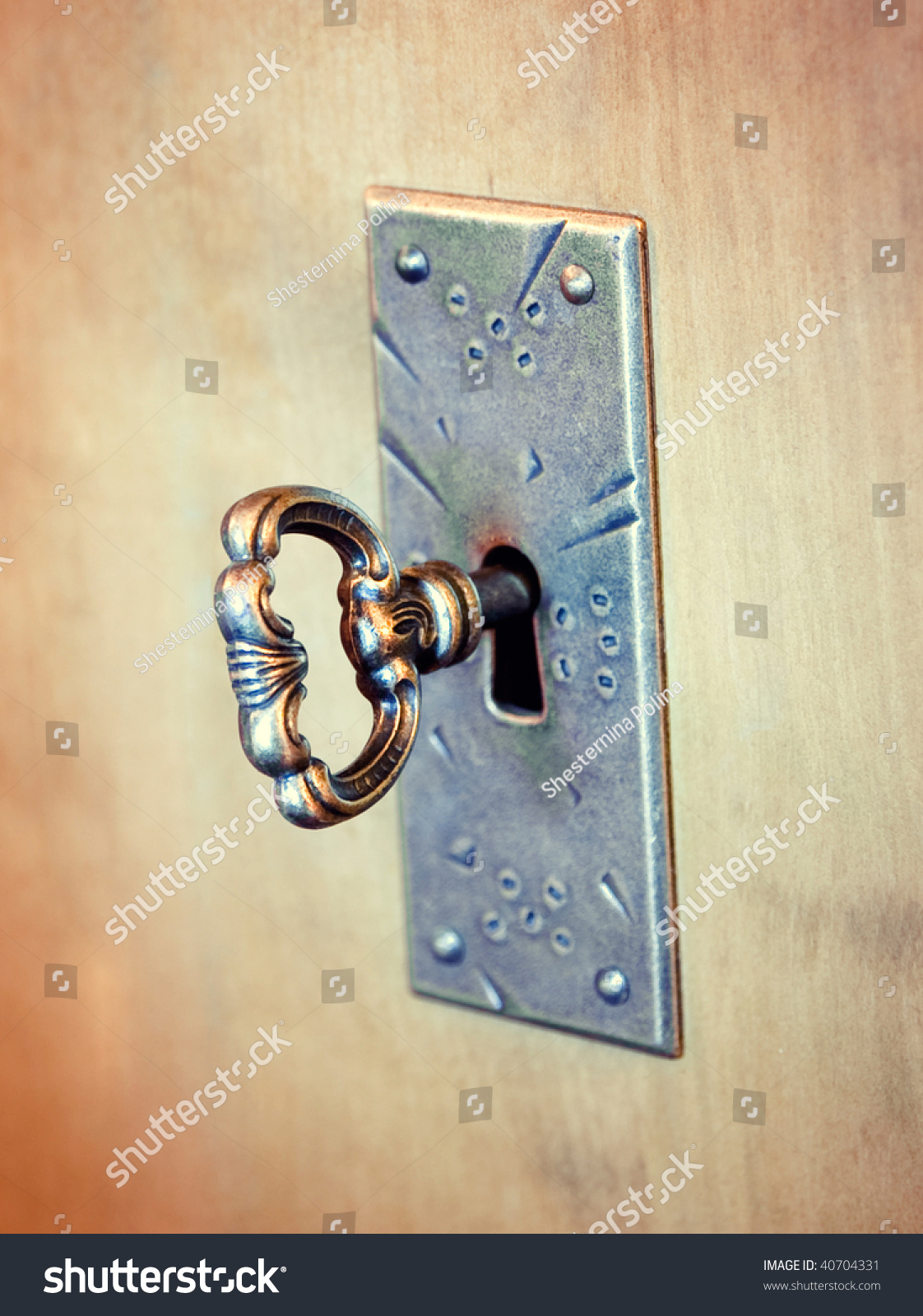 Old-Fashioned Key In A Keyhole Stock Photo 40704331 : Shutterstock