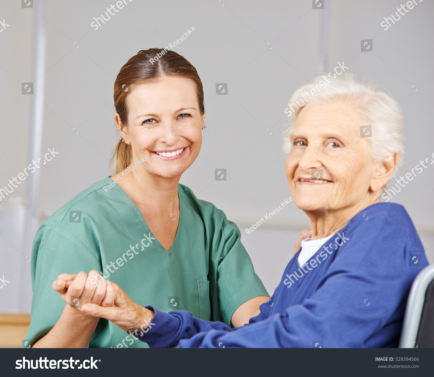 Old smiling senior woman with geriatric nurse in a nursing home Old smiling senior woman with geriatric nurse in a nursing home