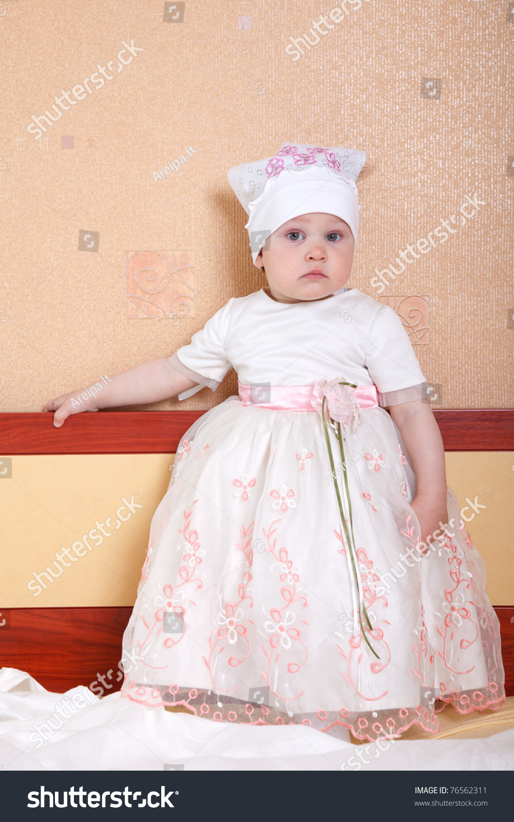 One Year Old Baby Girl Wearing White And Pink Dress Stock Photo 76562311 : Shutterstock